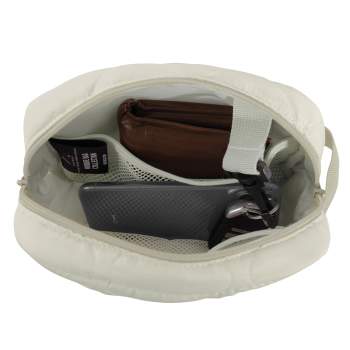 top view of white day bag opened with phone, wallet and other items inside