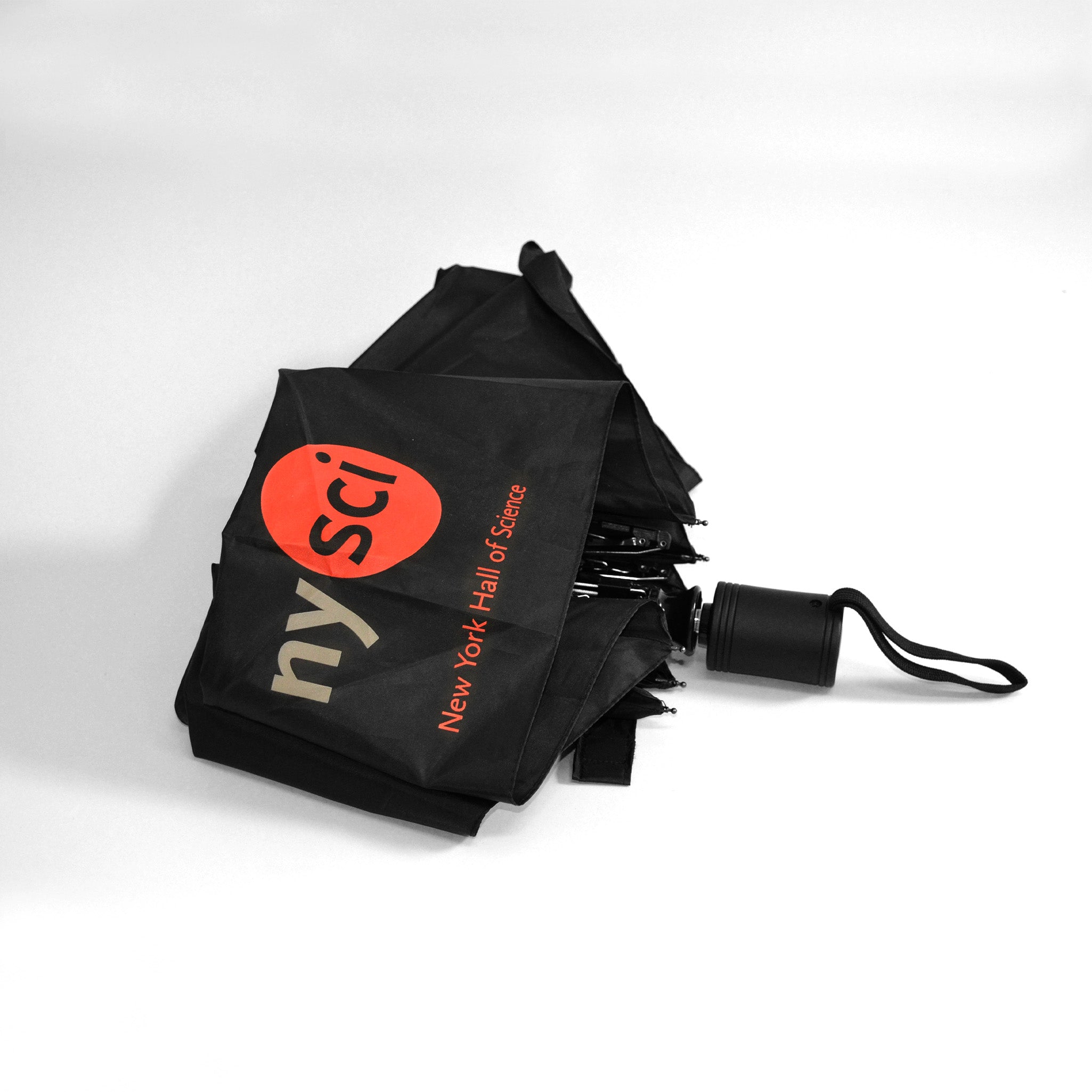 black umbrella with nysci logo showing in red and white