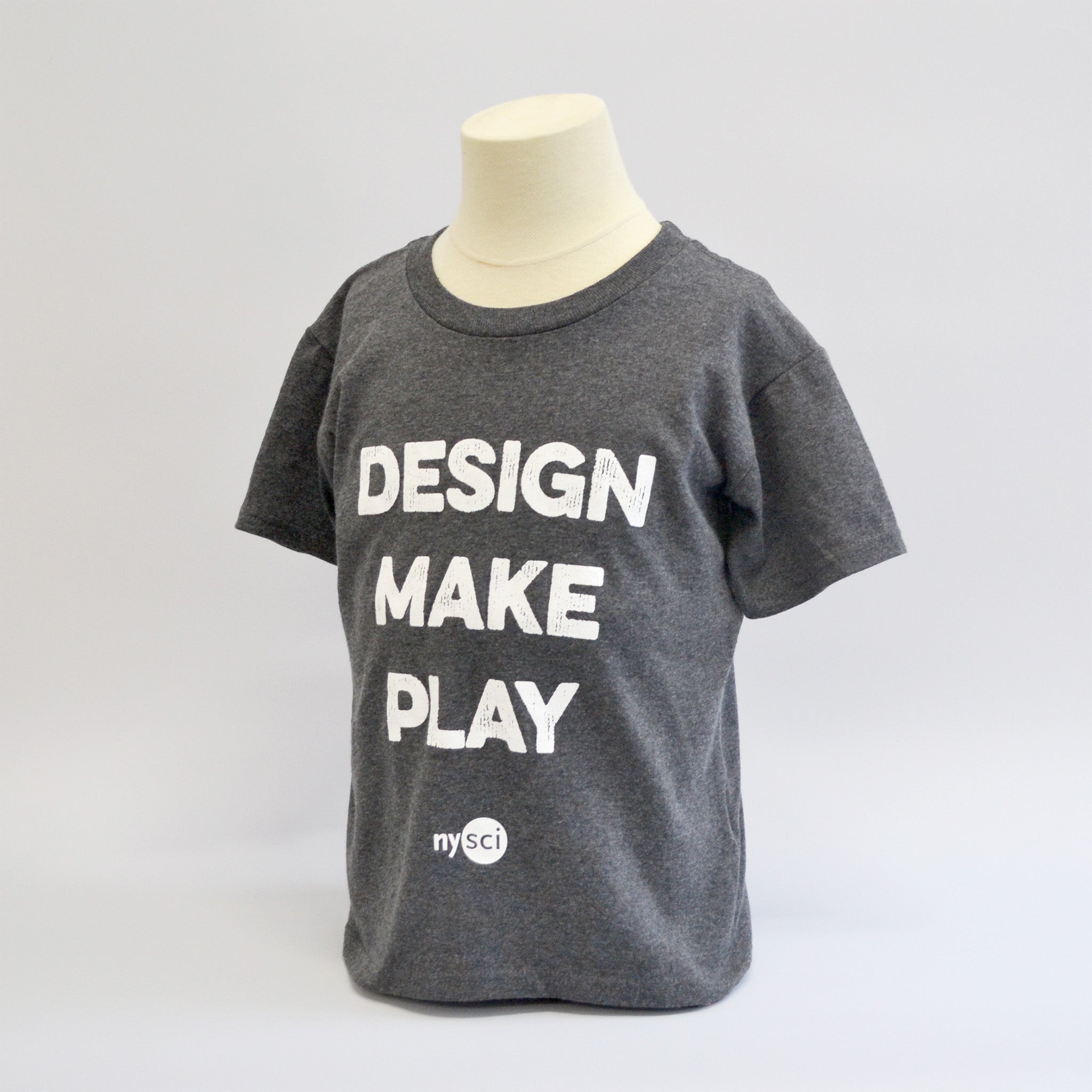 Medium grey round neck t-shirt with the words "design make play" in a large bold font with the NYSCI brand below it. Left side facing image