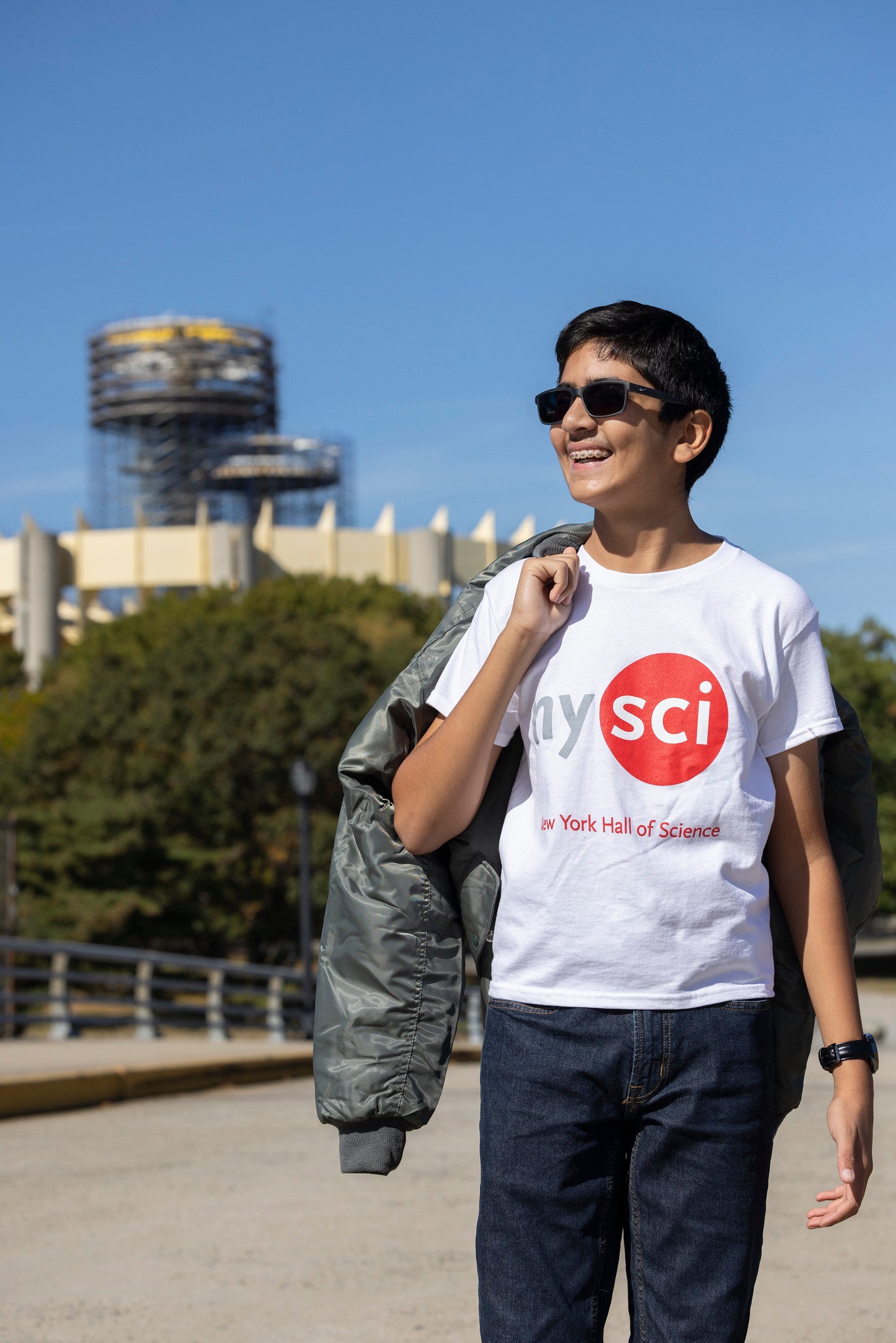 Boy in Corona park wearing white nysci branded t-shirt