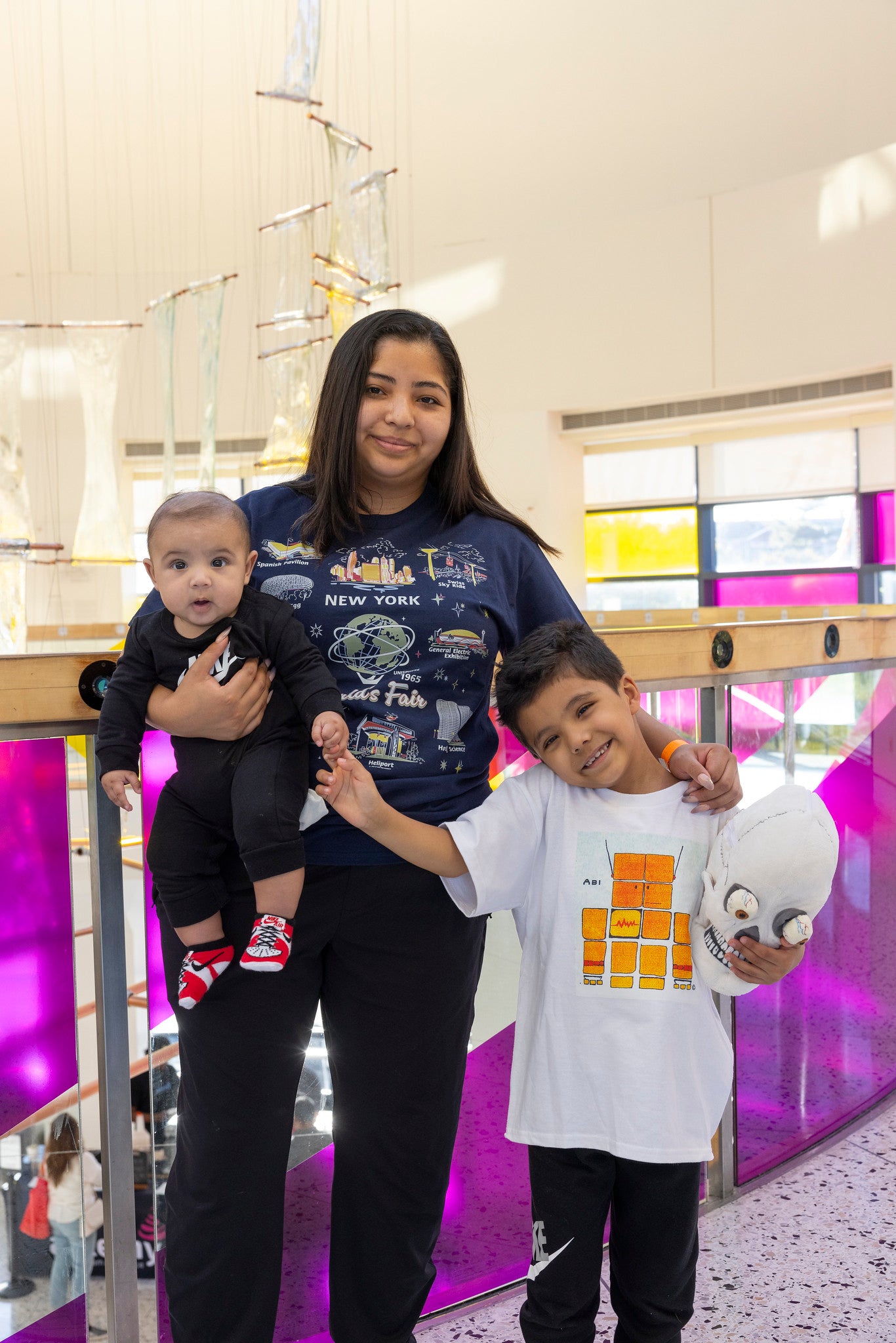 woman and two children at the museum