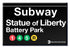 Magnet that looks like a black and white Subway sign with the words - Subway, Statue of Liberty, Battery Park. Showing logos for Subway Lines, 1, 4, 5, R