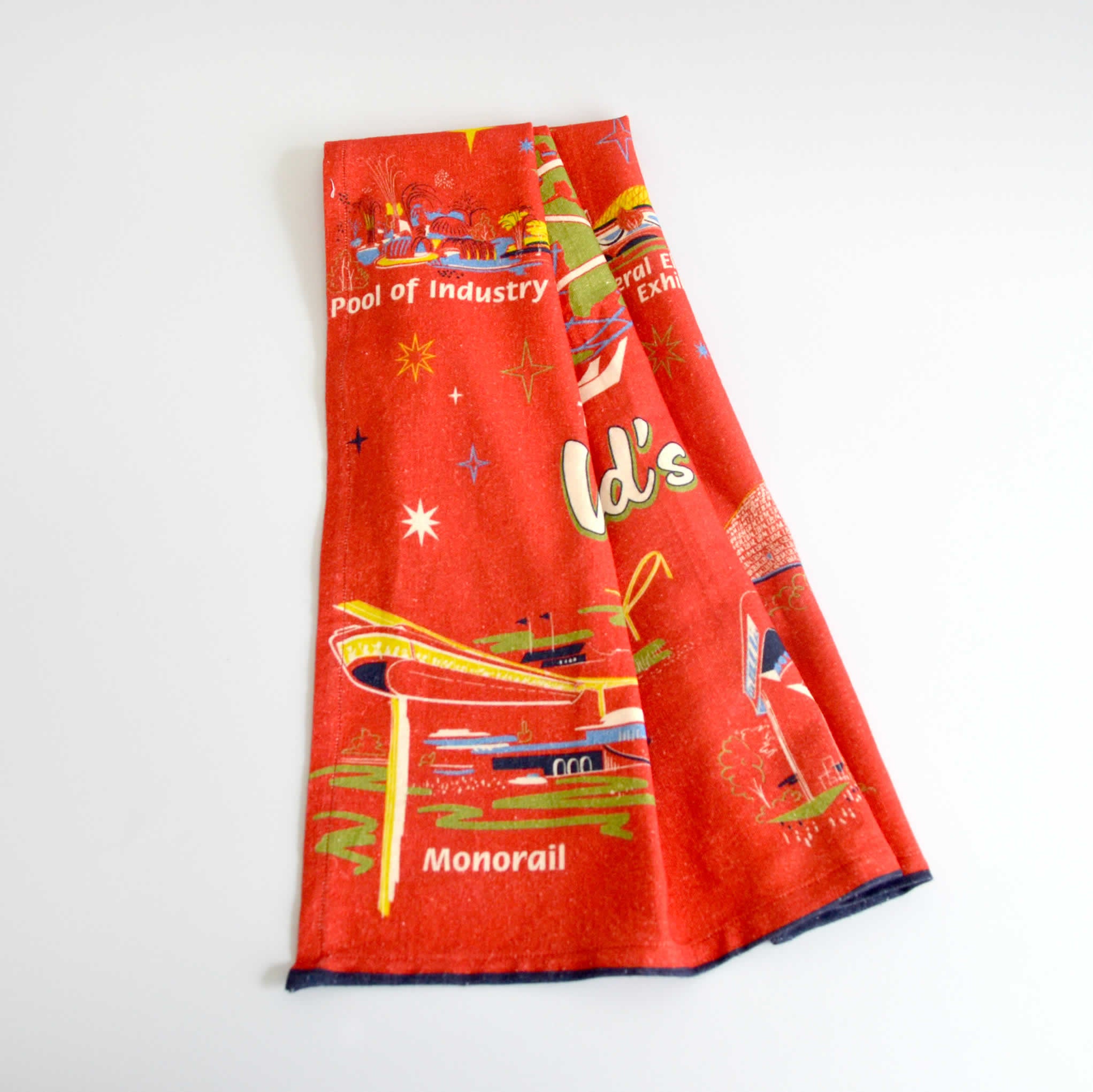 Red Tea Towel draped showing the buildings of the 1964 World&