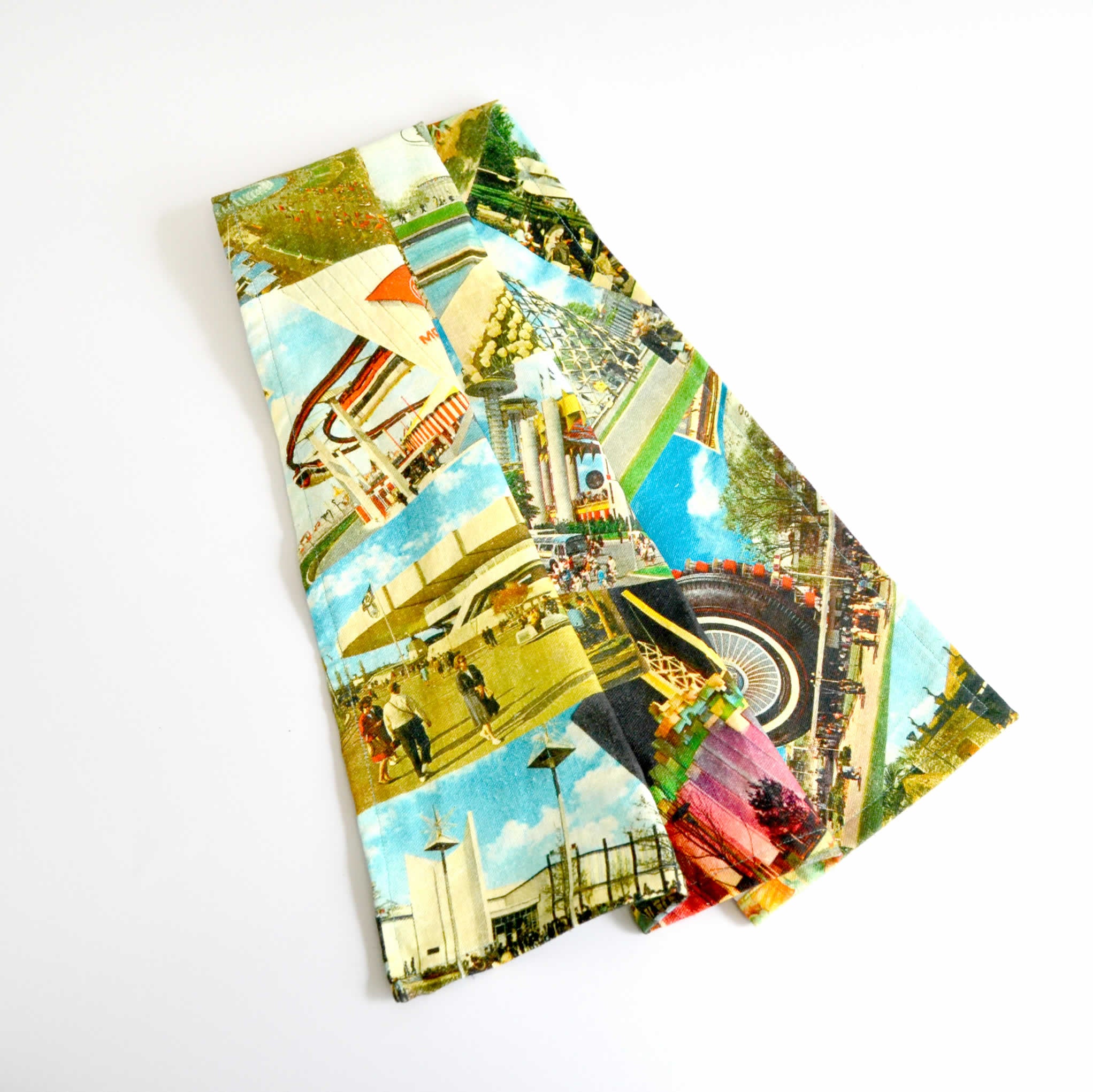 Colorful draped tea towel with vintage postcard images on the front