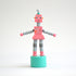 Pink toy robot front view on white background