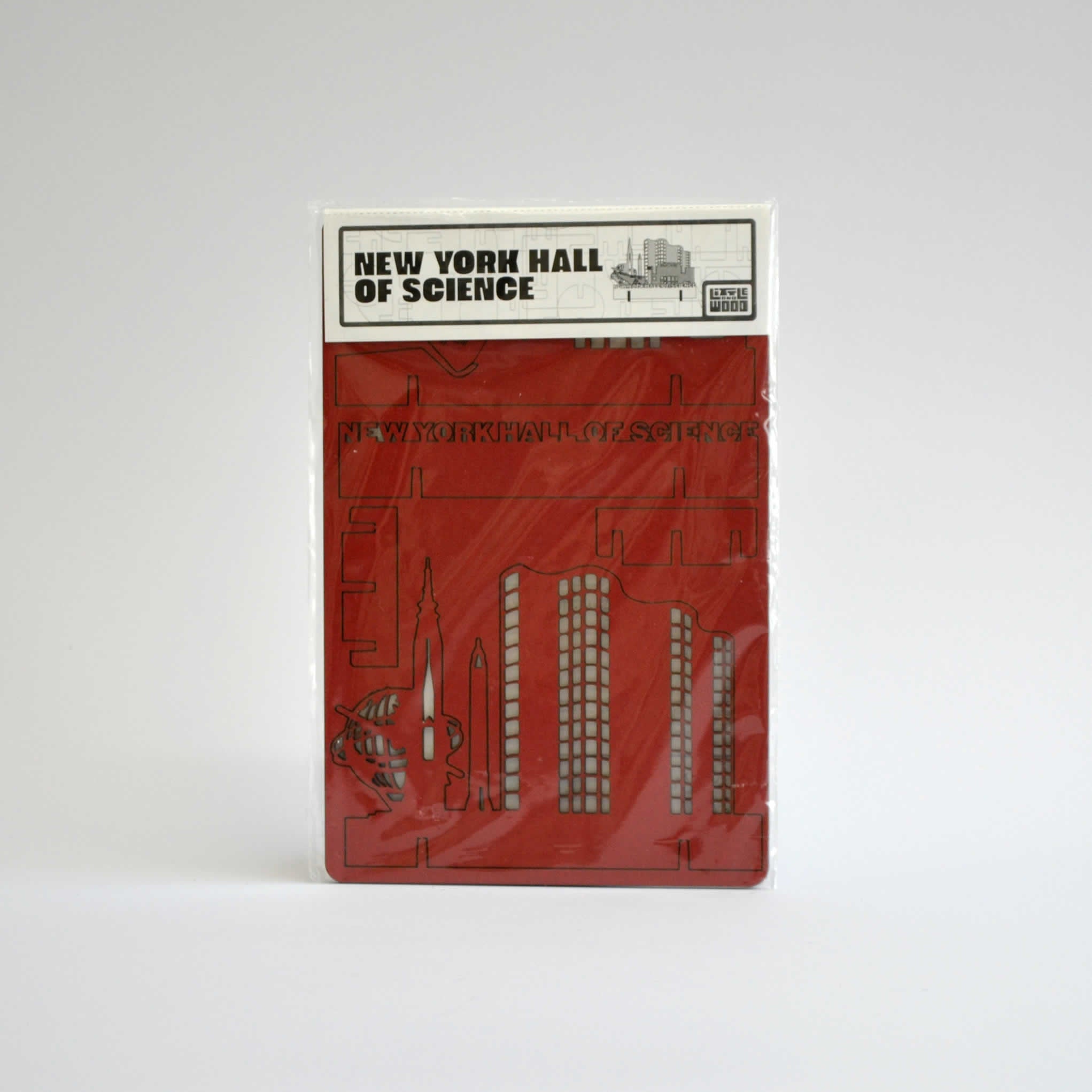 Packaging of the red NYSCI wooden puzzle