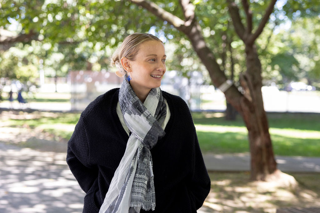 Woman wearing a scarf in a park setting