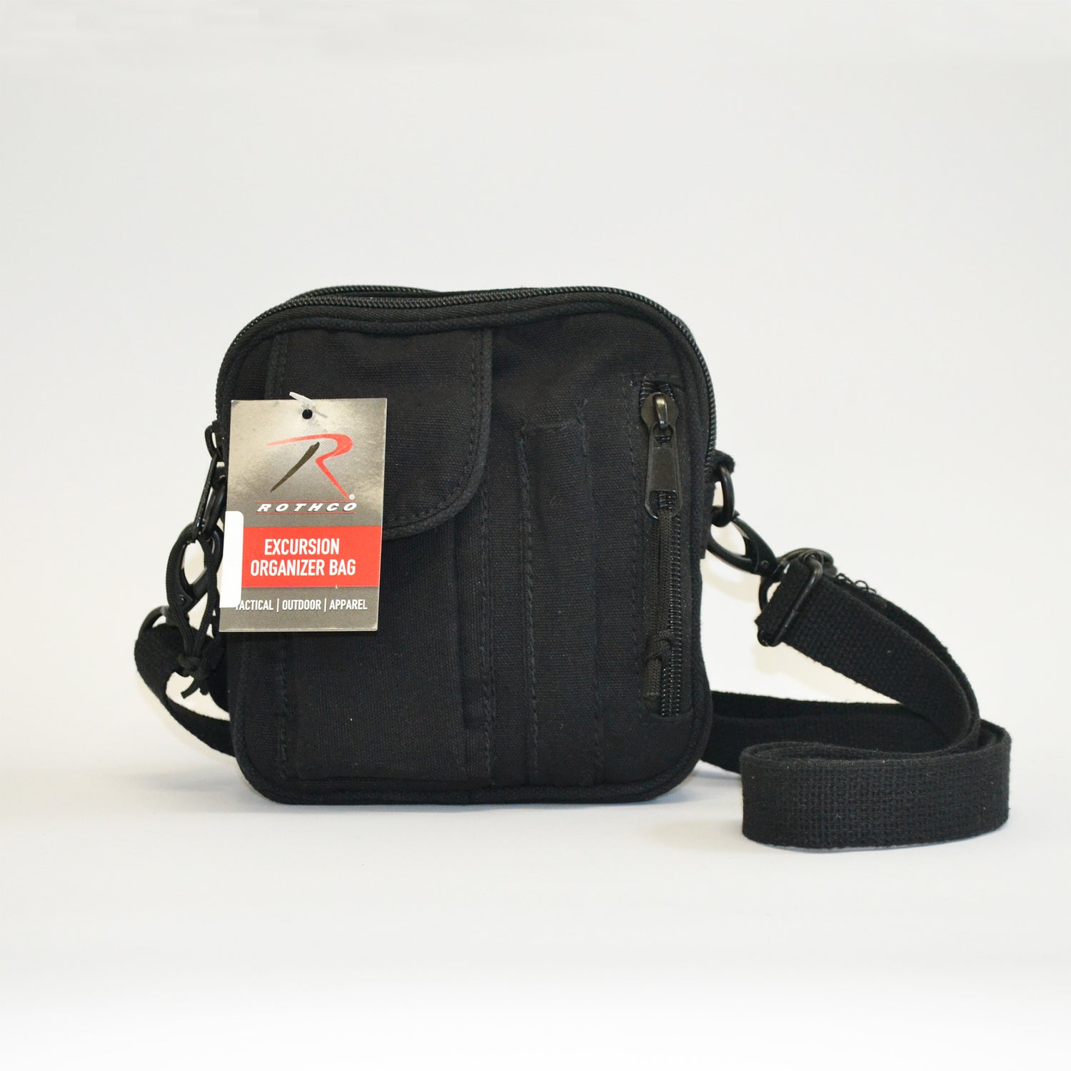 Small black bag with a flap pocket, a pencil skinny pocket and a zipper on the right side. front facing image