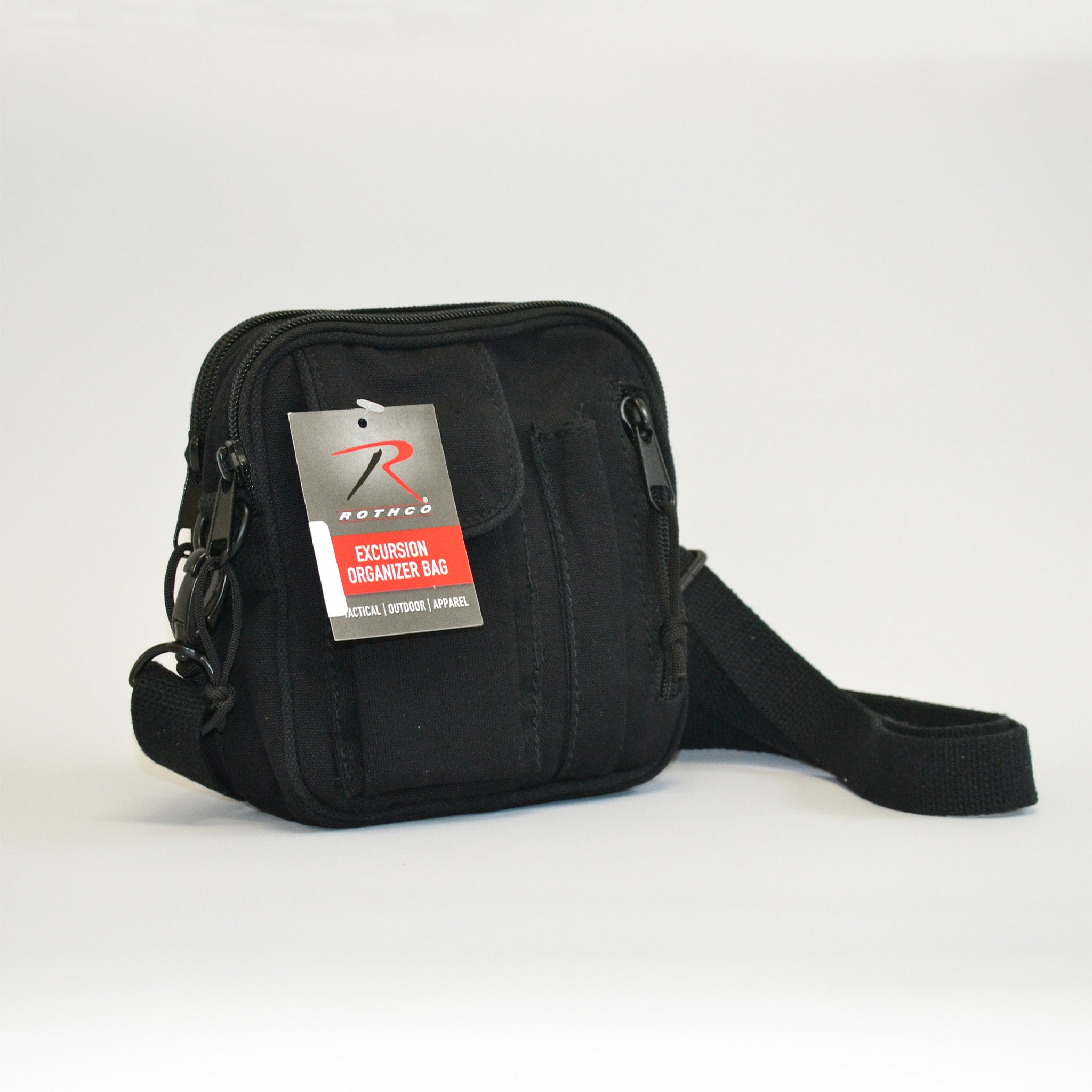 Small black bag with a flap pocket, a pencil skinny pocket and a zipper on the right side. Right side facing image