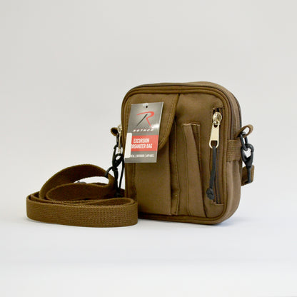 Small brown bag with a flap pocket, a pencil skinny pocket and a zipper on the right side with the adjustable strap showing. Left side facing image