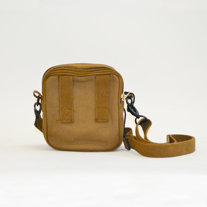 Small brown bag facing away from the screen with the adjustable strap shown.