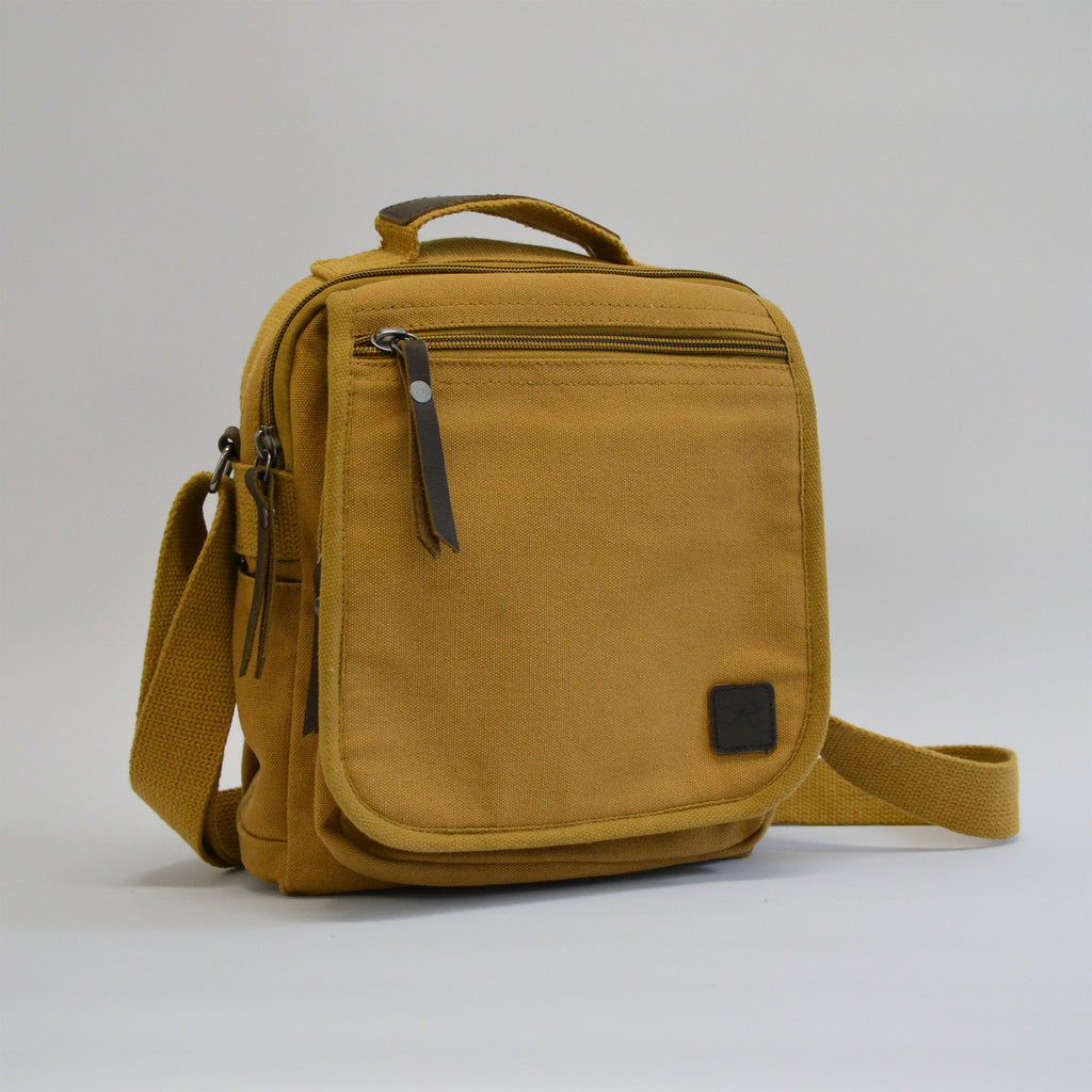 Light orange-brown colored bag with a front zipper and a slightly larger zipper, facing slightly to the right