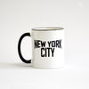White coffee mug with black lettering of NEW YORK CITY - view with black handle on the left side