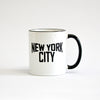 White coffee mug with black lettering of NEW YORK CITY - view with black handle on the right side
