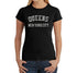 Woman wearing a black tshirt with design of Words, Queens, New York City on black background as design. Letters made up of words of Queens neighborhoods