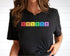 Womans blak t-shirt with the elemental letters on it spelling out in-cl-u-si-o-n