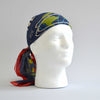 White foam head modelling the blue World's Fair head scarf