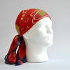 White foam head modelling the red World's Fair head scarf