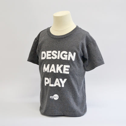 Medium grey round neck t-shirt with the words &quot;design make play&quot; in a large bold font with the NYSCI brand below it. Left side facing image