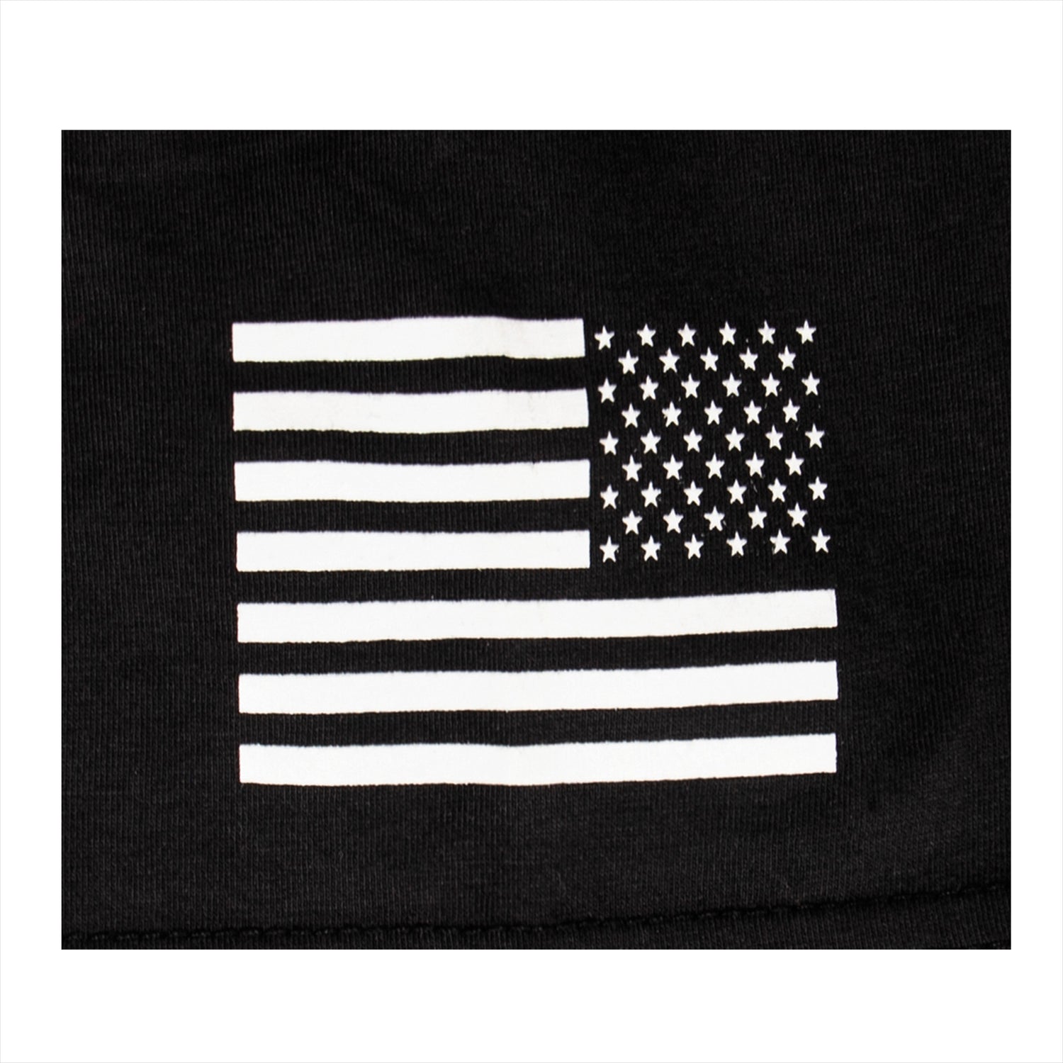 Closeup of black and white American Flag flying backwards