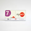 Two coasters showing in a package set of coasters. One has logo of the 7 train in purple, and the other shows the nysci logo