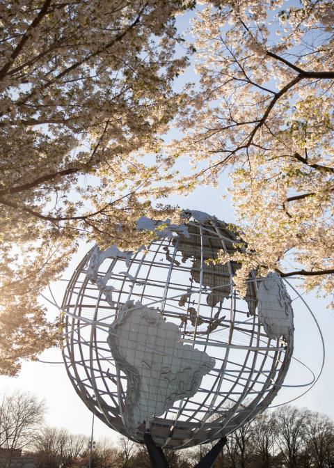 Corona Park steel Globe in fall with trees in front