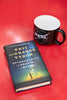 Astrophysics book by Neil DeGrasse Tyson on a red table with a NASA mu next to it