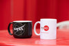 NASA mug and a white nysci branded mug