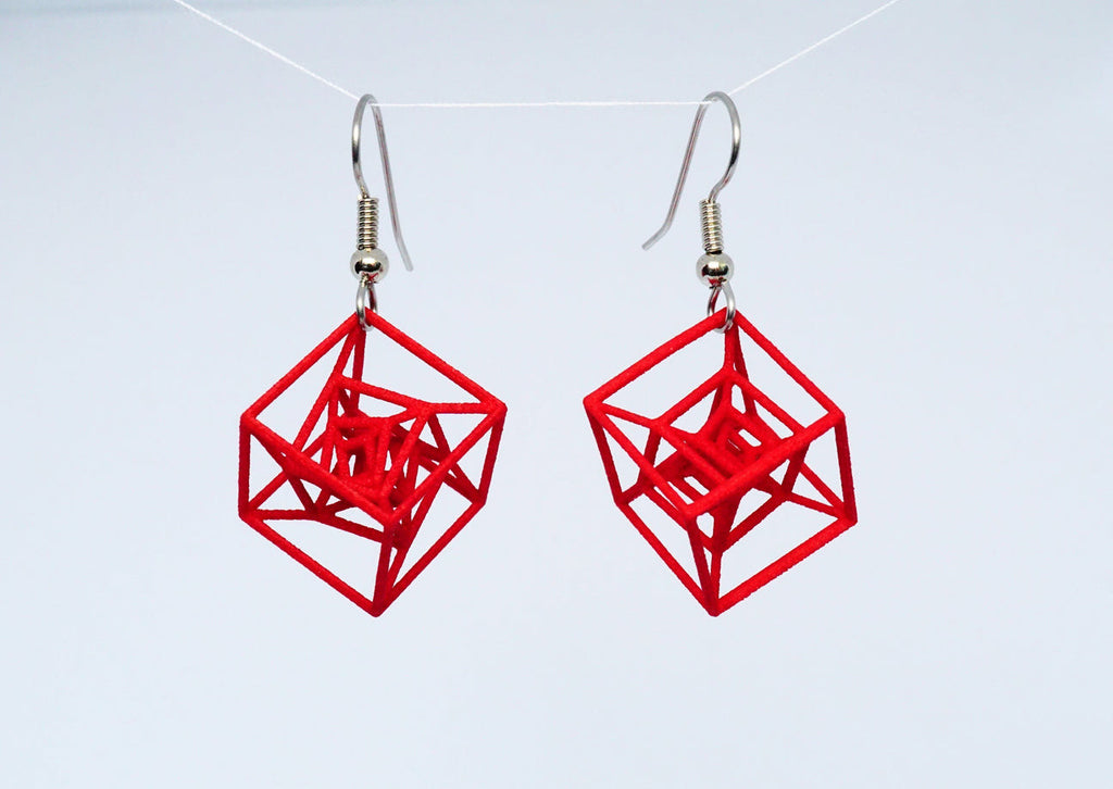 Red square inception earrings on a white background