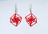 Red square inception earrings on a white background
