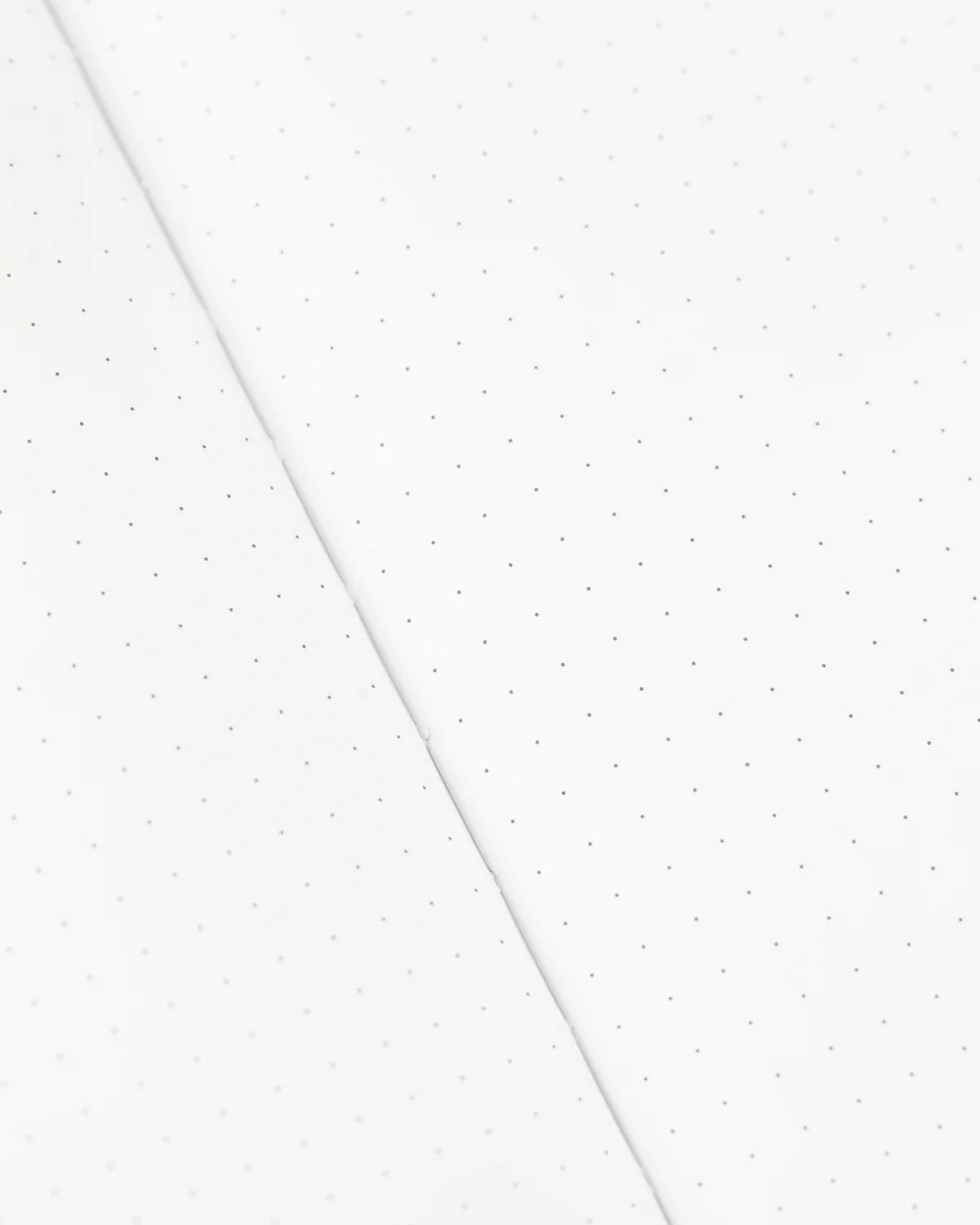 Dots in a grid pattern on a notebook page 