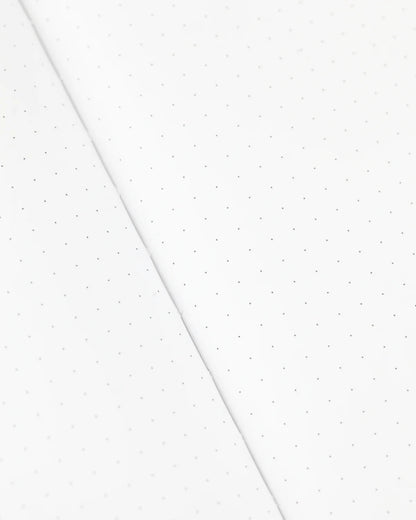 Dots in a grid pattern on a notebook page 