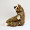 Fluffy sloth plush with long arms, sitting down. Entire body facing the left side