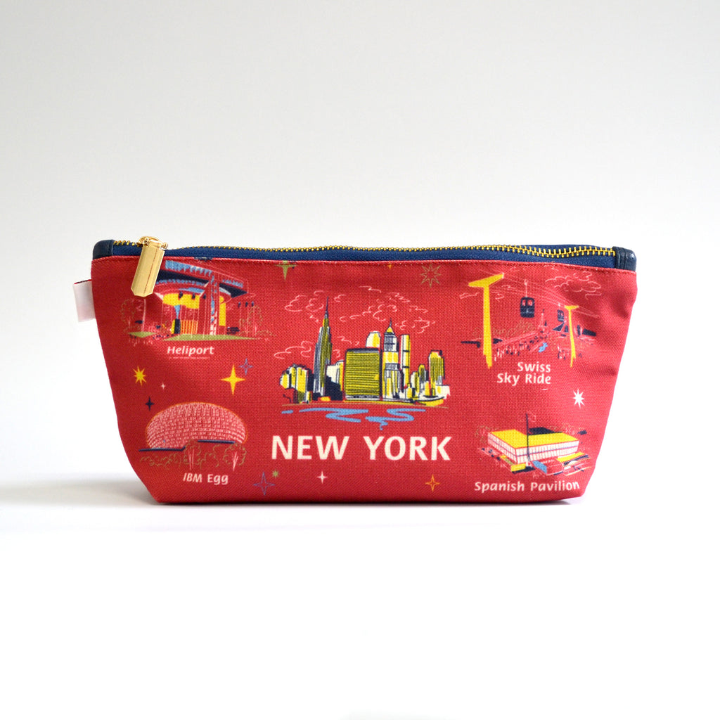 Red zipper pouch with images of Worlds Fair buildings on a white background