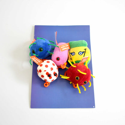 5 Colorful plush microbe toys on a purple background