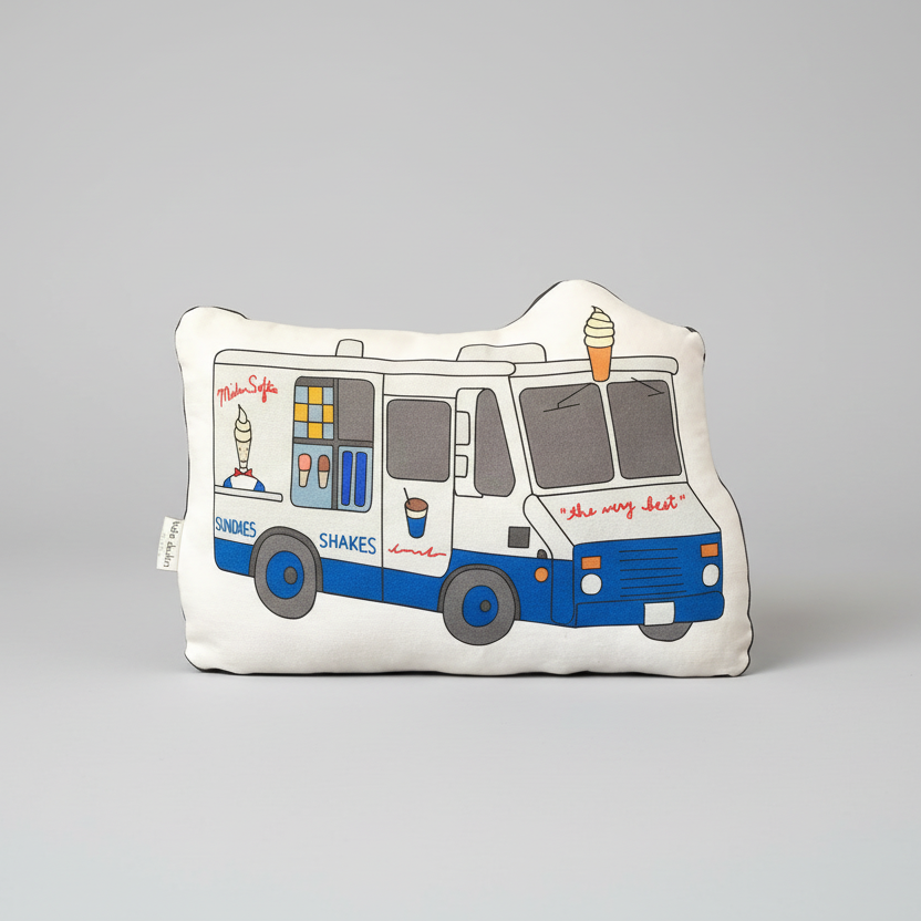 Decorative pillow shaped like an ice cream truck on a white background