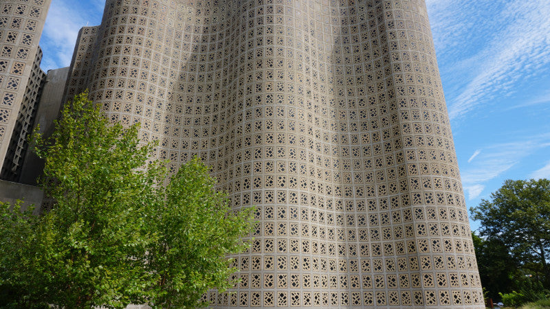 Outside photo of the Hall of Science Museum wavy walls