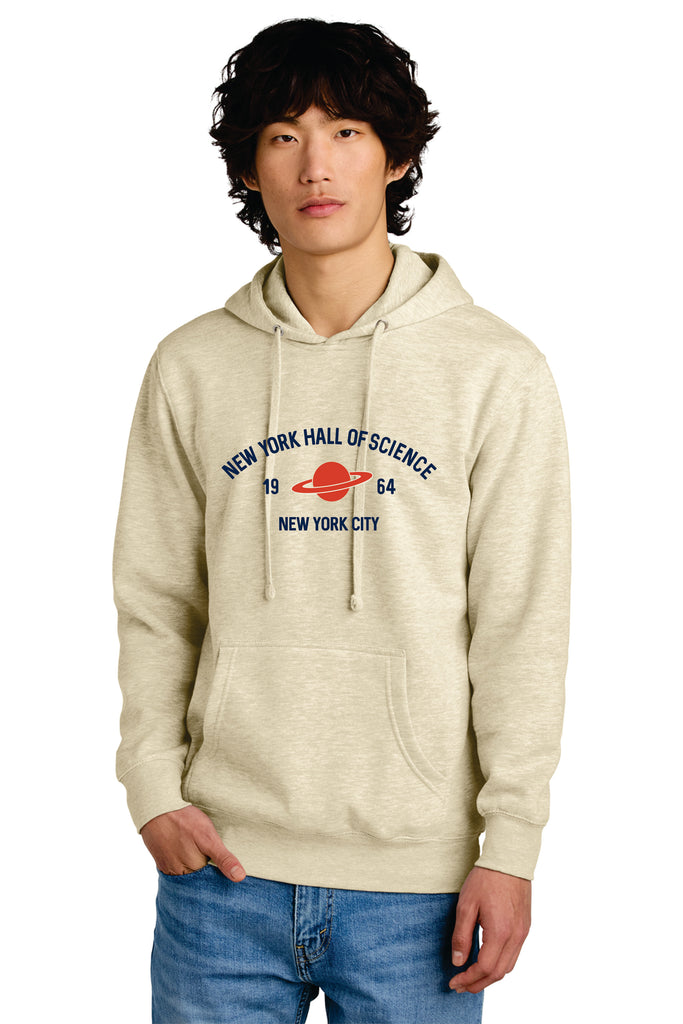 Person wearing a beige hoodie with a logo and text on a white background